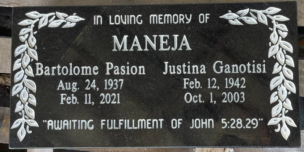 Black granite companion plaque with laurel leaf engraving and a scripture line
